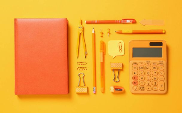 Flat lay composition with different school stationery on yellow background - Valokuva, kuva