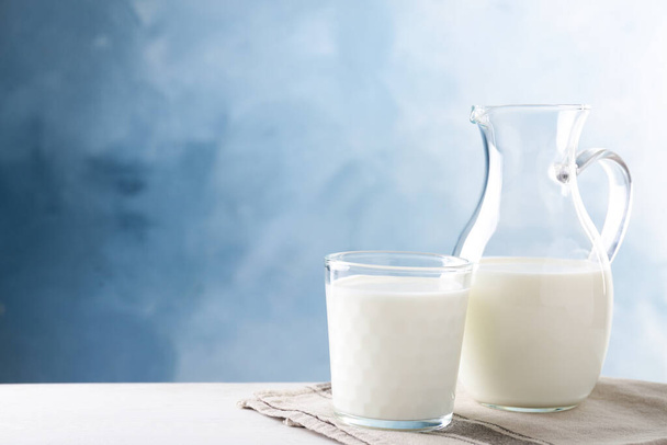 Delicious fresh milk on white table. Space for text - Foto, Bild