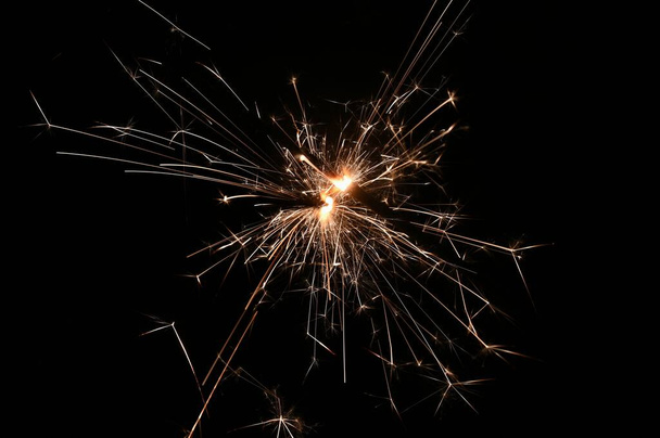 Sparkler - beautiful abstract background. Concept for Christmas and Happy New Year 2021. - Foto, immagini