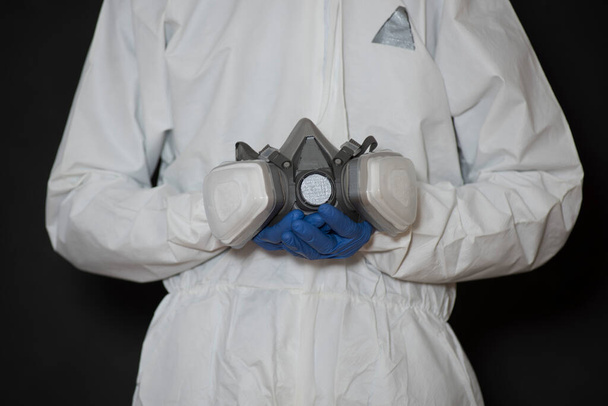 masker van de ademhalingsapparatuur of gasmasker, preventie van gevaar op de werkplek - Foto, afbeelding