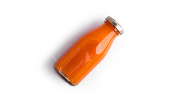 Carrot juice isolated on a white background. - Photo, image