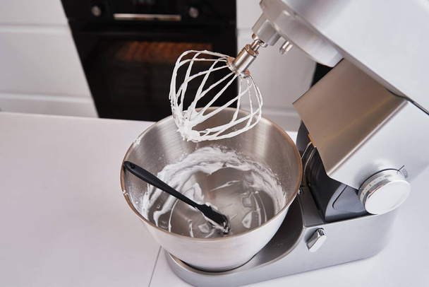 Food processor cooking dough in the kitchen interior - Foto, Bild