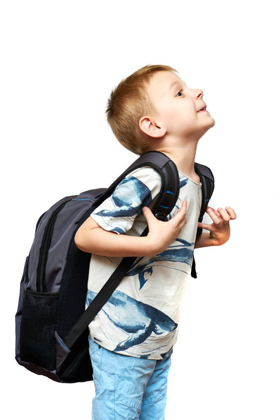 Young boy with a big backpack. Sad facial expression. Isolated on white. - Zdjęcie, obraz