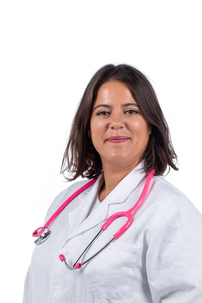 Caucasian doctor woman with pink stethoscope on a white background. - Фото, зображення