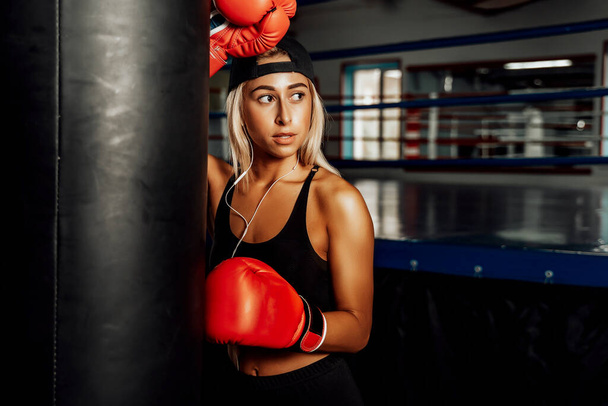 Beautiful Woman with the Red Boxing Gloves. Attractive Female Boxer Training - Fotoğraf, Görsel