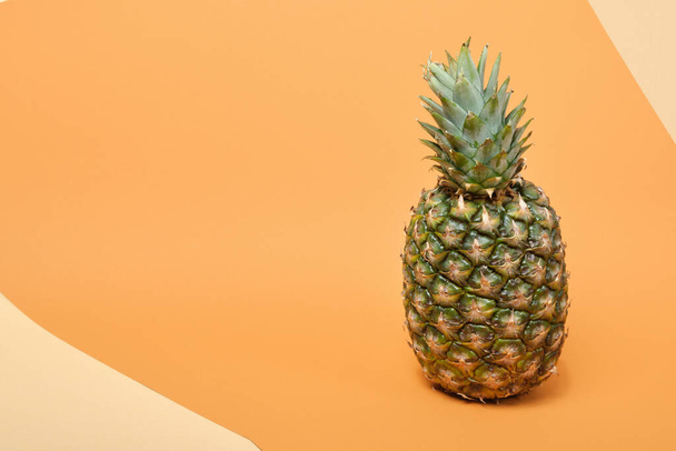 fresh ripe tasty pineapple on a brown and beige background copy space - Foto, Imagem