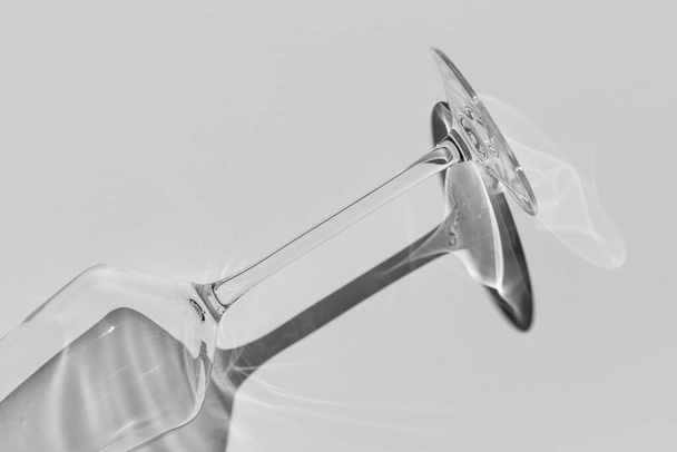 Champagne glass on white surface. Glass with shadow on white table. - Foto, immagini