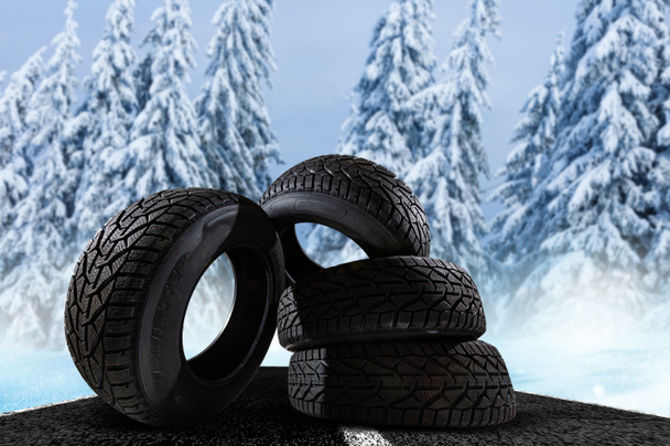 冬の背景に4本の冬用タイヤ - 写真・画像