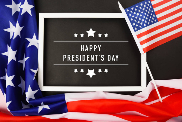 United States National Holidays. American or USA Flag with "HAPPY PRESIDENT'S DAY" text on black background, President Day concept - Foto, Imagem