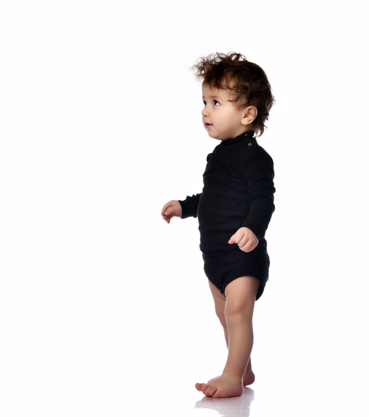Baby walking taking first step portrait isolated on white - Photo, image