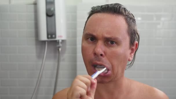 Male Person Brush Teeth in bathroom - Footage, Video