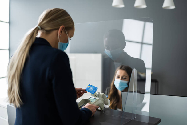 Hotel Reception Desk Counter With Face Mask - Foto, imagen
