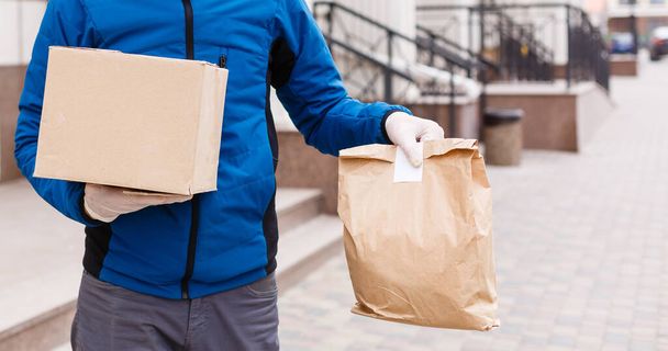 Diverse of paper containers for takeaway food. Delivery man is carrying - Zdjęcie, obraz