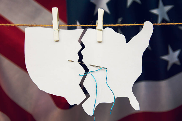 torn map of America USA is sewn back together as a symbol of healing and unite after problems crisis and chaos of division in country - Zdjęcie, obraz