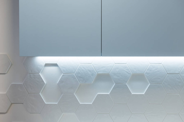 Kitchen cabinet on wall with hexagon tiles in modern kitchen - Photo, Image