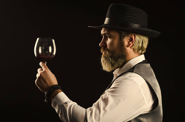 Sommelier responsibility work within taste preference. Sediment should be present in older red wines. Sommelier appreciating drink. How You Can Spot Fake Wines. Wine service. Sommelier taste wine - Φωτογραφία, εικόνα
