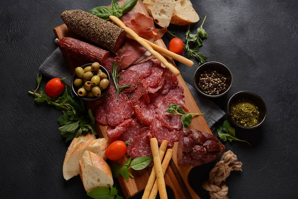 Antipasto Platter salami smoked sausage and olives   with grissini bread sticks - 写真・画像
