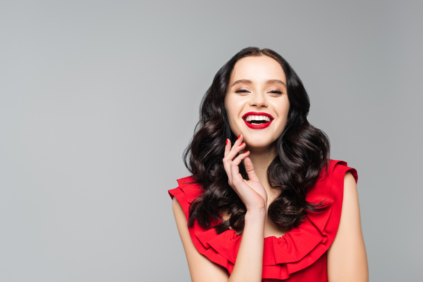 cheerful young woman with red lips isolated on grey  - Fotografie, Obrázek