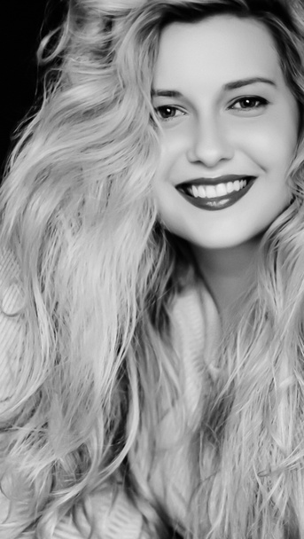 Natural hair care routine for blonde hair, woman with long wavy hairstyle, hairspray and styling product, beauty and 90s style look. Artistic black and white with film grain added - Photo, Image