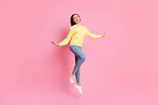 Full size photo of young beautiful happy smiling positive good mood girl jump fly isolated on pink color background - Photo, image