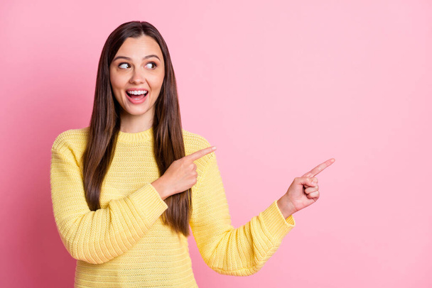 Photo of young attractive excited amazed happy charming girl look point fingers in copyspace isolated on pink color background - Φωτογραφία, εικόνα