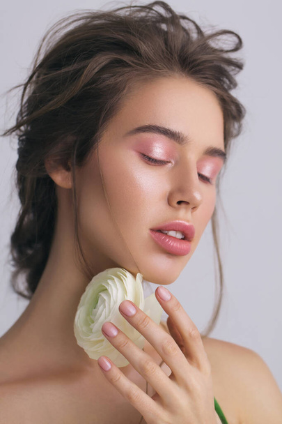 Portrait of woman with makeup and flower - Photo, Image