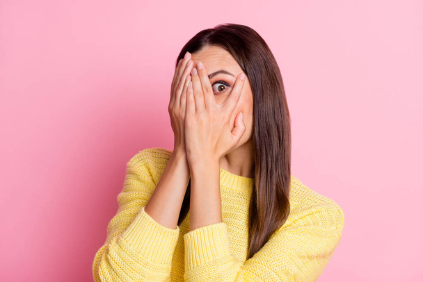 Photo of feared scared young woman dressed casual clothes arm cover eye isolated pastel pink color background - Φωτογραφία, εικόνα