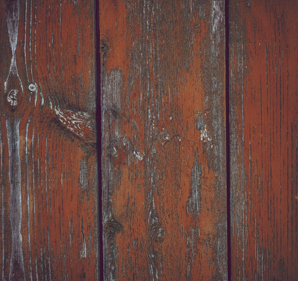 Beautiful wood texture, cracks, old paint. Grunge background from weathered yellow wooden plank. rusty sharp nails. - Foto, Bild