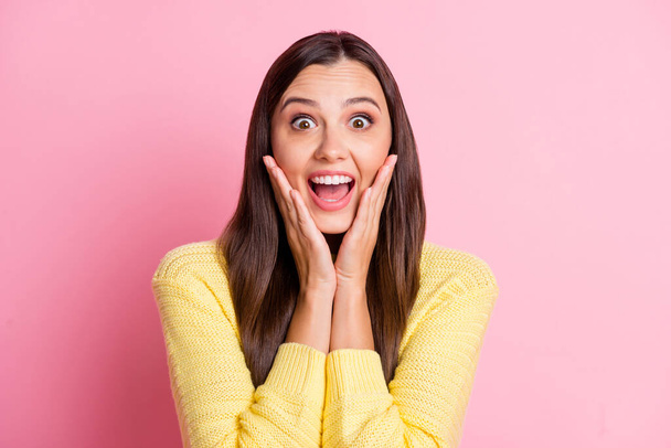 Portrait of young attractive beautiful shocked amazed happy smiling woman hold hands cheeks isolated on pink color background - Фото, изображение