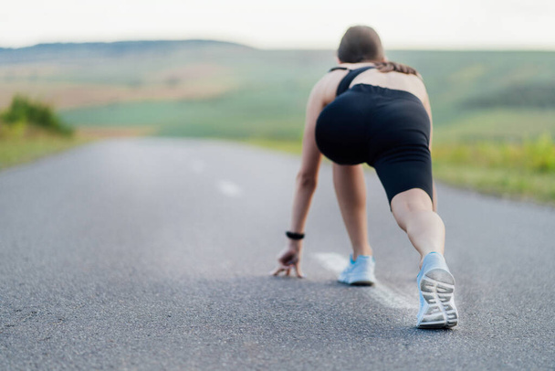Fitness woman running on seaside trail in the morning. Sport woman. - Foto, imagen