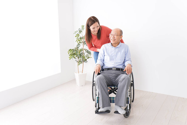 Woman care for elderly person - Photo, Image