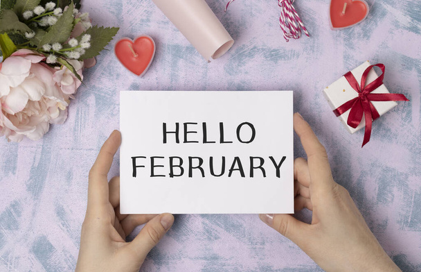 Hello February Word on Light box with roses flower bouquet on wooden background - 写真・画像