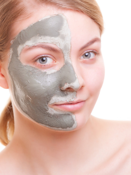 Skin care. Woman applying clay mask on face. Spa. - Foto, immagini