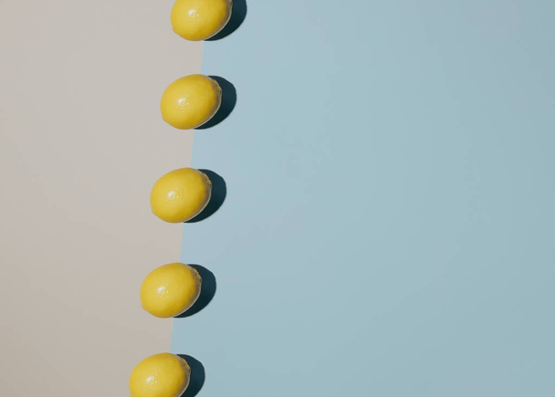 Aesthetic arrangement of healthy lemons on modern color background. Minimal concept - Photo, Image