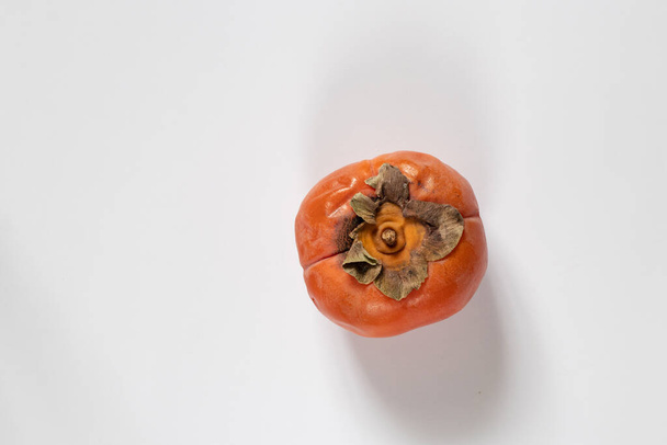 persimmon on isolated white background close up - Foto, Imagen