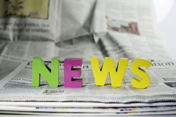 Word news on newspaper - Foto, Bild