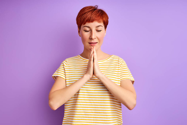 calm female with natural red short hair meditating, pray - Valokuva, kuva
