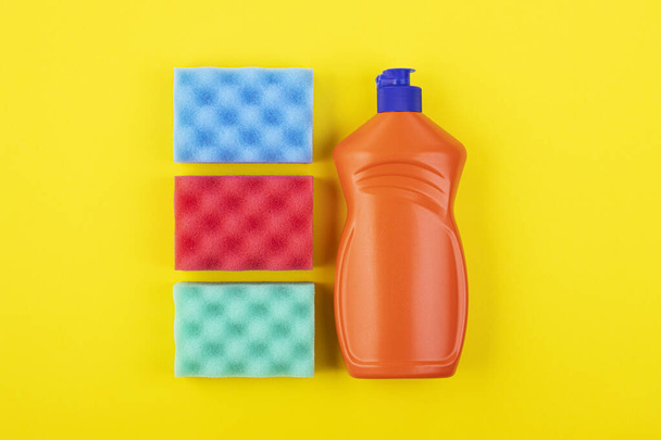 cleaning products display nolling on a yellow background, top view. the concept of cleaning and cleanliness - Foto, Imagem