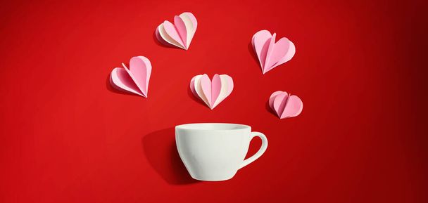 Coffee cup with paper craft hearts - Valokuva, kuva