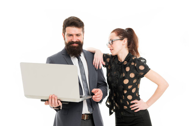 happy to see good results. happy bearded man and woman with laptop. businessman with partner look with positive smile. partnership was successful. businessman and secretary work on laptop in office - Φωτογραφία, εικόνα