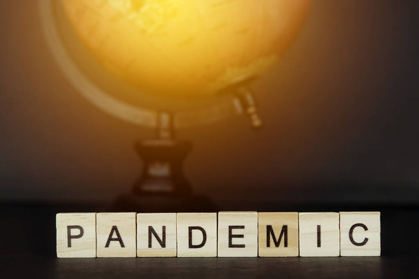 Global Pandemic Concept - Word tiles - Covid 19 - Corona Virus - Globe - Foto, Imagem