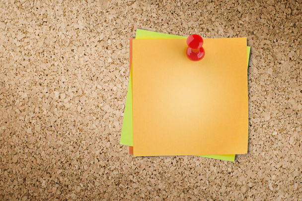 several sticky notes hang on a corkboard - Photo, Image