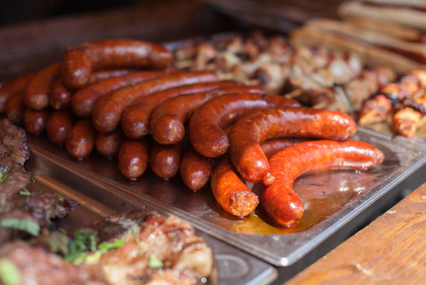 traditional street food with meat and sausages. - 写真・画像