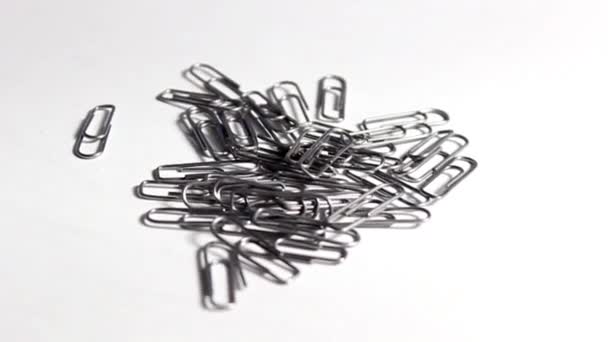 Lots of metal paper clips. Office supplies. Turntable. Selective focus. - Footage, Video