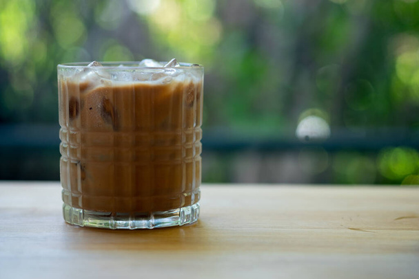 Iced coffee in mini glass on wood table. - Photo, image