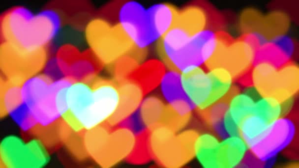 iluminación de corazones coloridos para vacaciones o fondo boke abstracto - Imágenes, Vídeo
