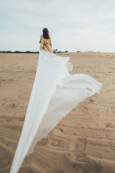 female freedom woman independence wind sand desert - Fotoğraf, Görsel