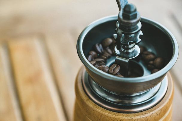 Closeup image of a vintage wooden coffee grinder - Photo, image