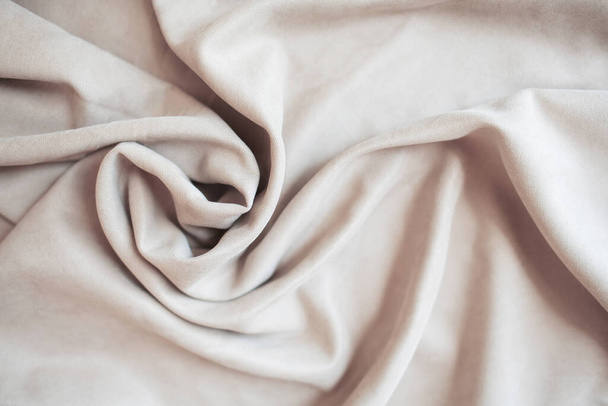Beige velour pleats. Soft blackout curtains for the room. Fabric for tailoring - 写真・画像