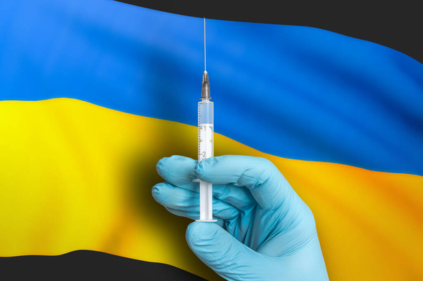 Вакцинація в Україні. Vaccine for protect against Covid-19 on background of national flag. - Фото, зображення